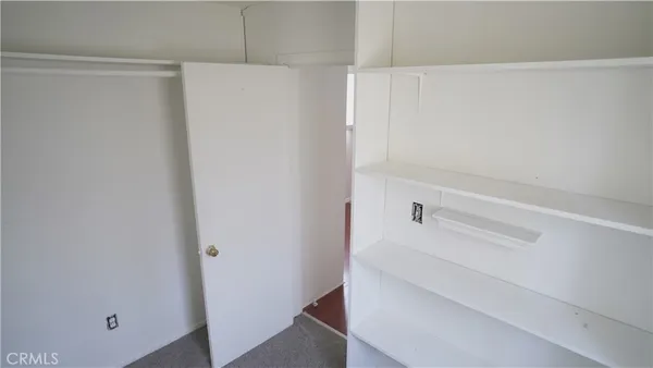 a kitchen with stainless steel appliances kitchen island granite countertop a sink stove and refrigerator