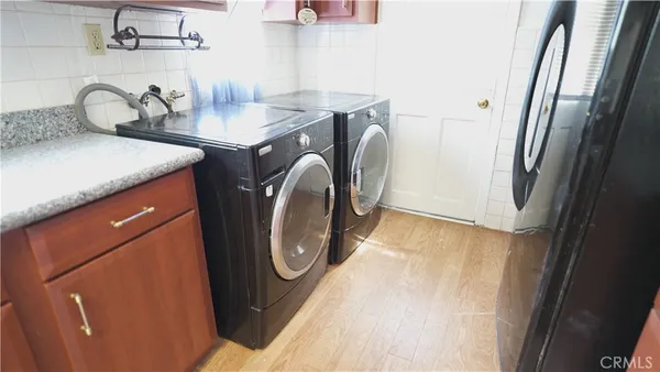 a kitchen with a stove microwave and refrigerator