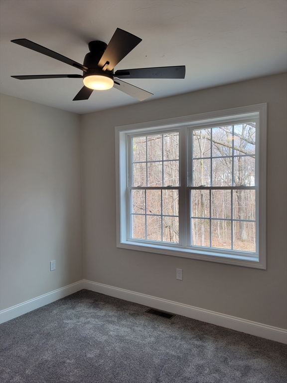 741 Chestnut Street Athol, MA 01331 - Photo 6 of 13 an empty room with wooden floor and windows