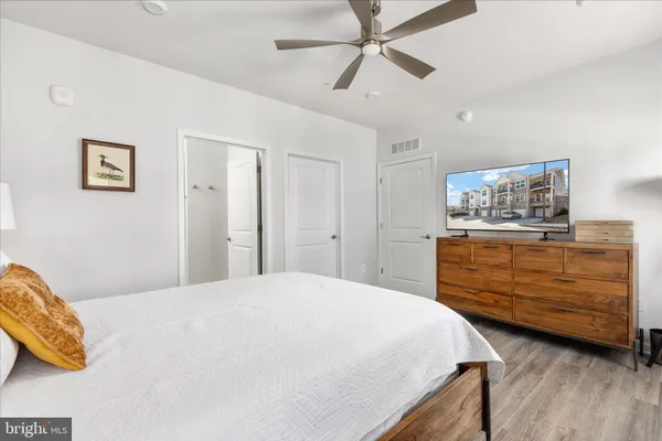 a bedroom with a bed and a dresser