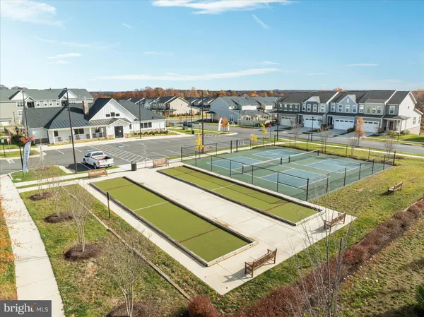 a living room with furniture a window and a table