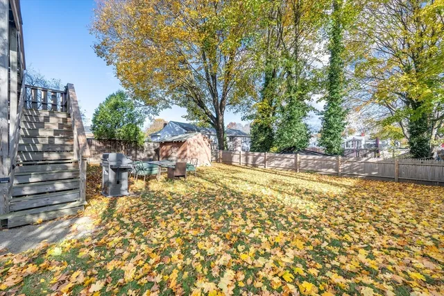 a view of yard with swimming pool and trees