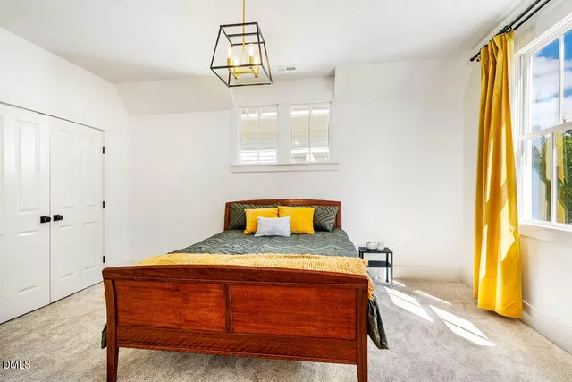 a bathroom with a sink mirror vanity and toilet
