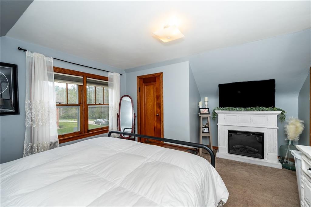 463 Butler Road Kittanning, PA 16201 - Photo 14 of 30 a bedroom with a bed and a flat screen tv