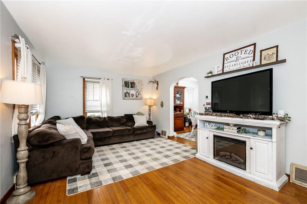 463 Butler Road Kittanning, PA 16201 - Photo 3 of 30 a living room with furniture a flat screen tv and a fireplace