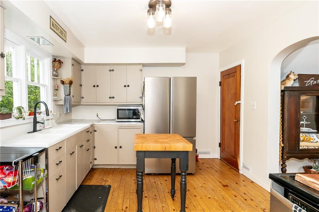 463 Butler Road Kittanning, PA 16201 - Photo 9 of 30 a large kitchen with a table chairs refrigerator and cabinets