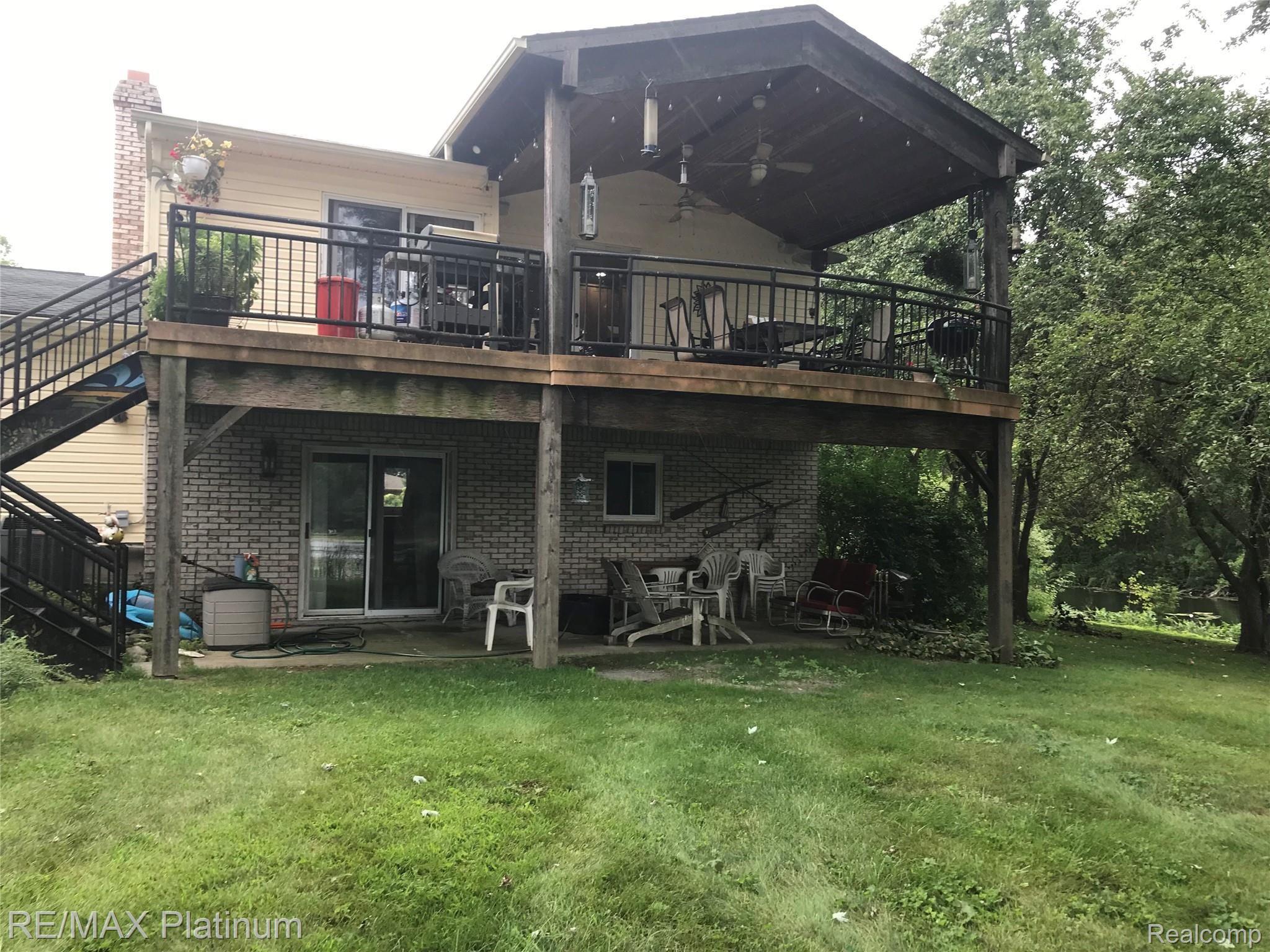 4211 Rurik Drive Howell, MI 48843 - Photo 24 of 25 Rear View/Covered Patio from Walkout