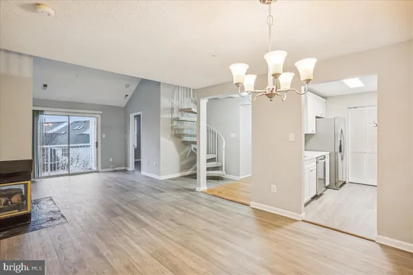 a view of a livingroom with wooden floor