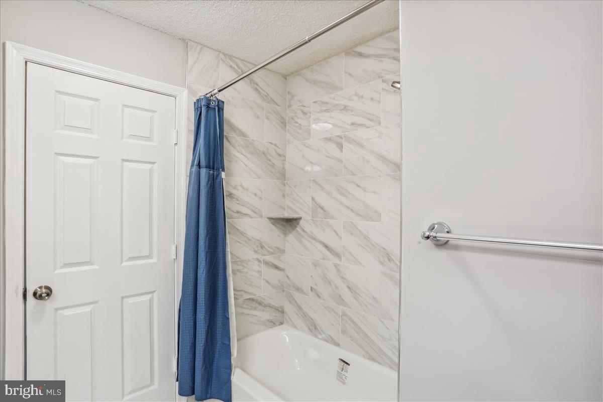 12901 Churchill Ridge Circle, Unit 14 Germantown, MD 20874 - Photo 12 of 46 a bathroom with a shower