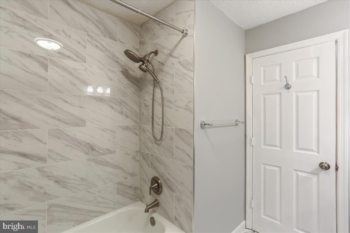 12901 Churchill Ridge Circle, Unit 14 Germantown, MD 20874 - Photo 13 of 46 a bathroom with a bathtub
