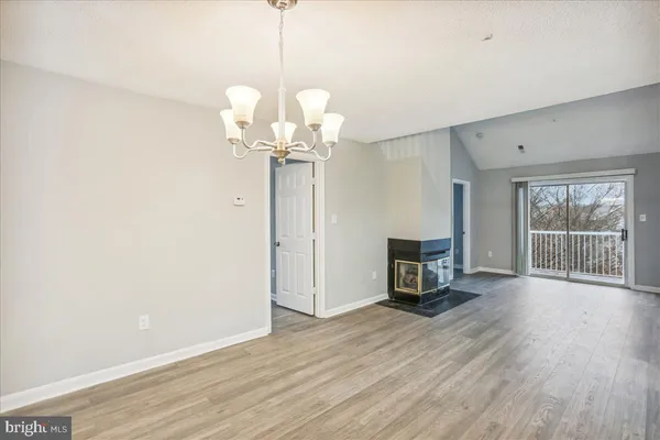 a view of a livingroom with wooden floor