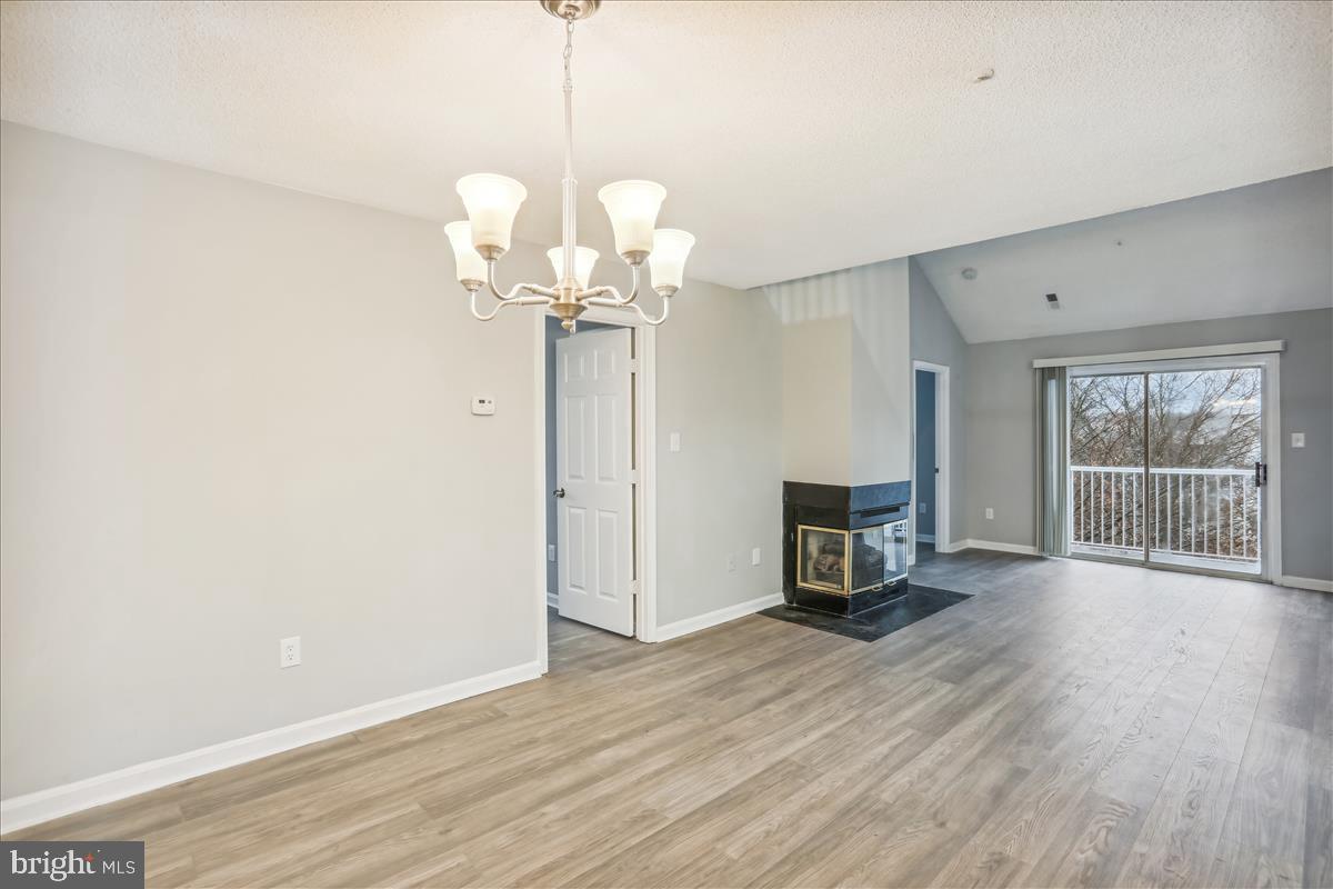 12901 Churchill Ridge Circle, Unit 14 Germantown, MD 20874 - Photo 25 of 46 a view of a livingroom with wooden floor