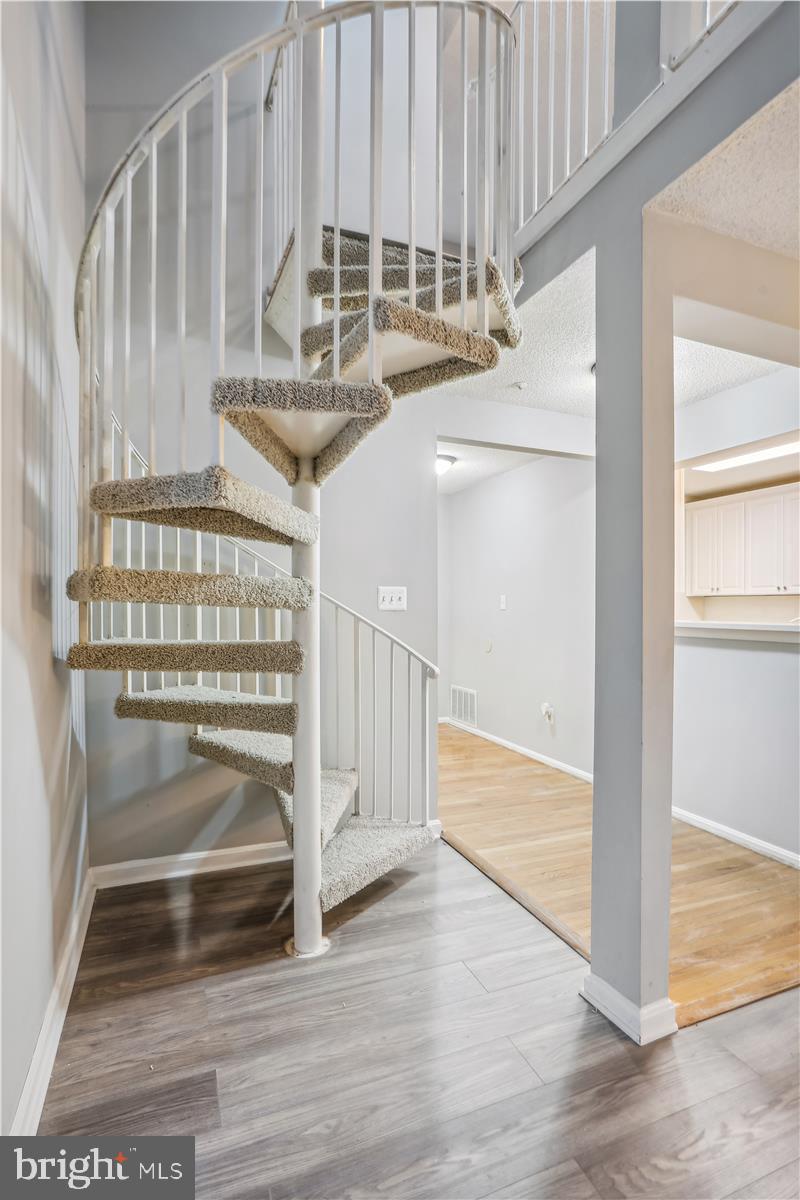 12901 Churchill Ridge Circle, Unit 14 Germantown, MD 20874 - Photo 32 of 46 a view of entryway and hall with wooden floor