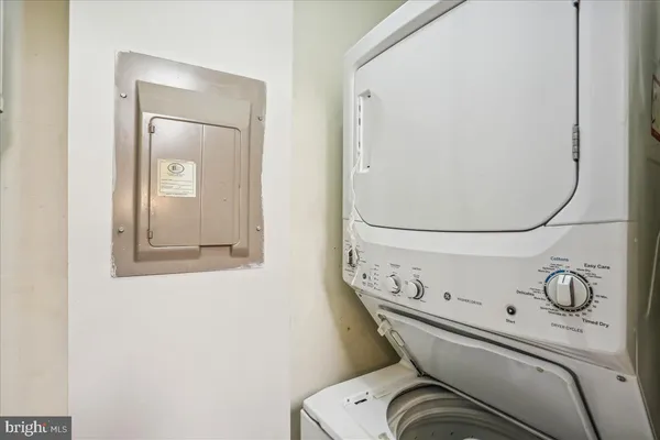 a close view of a utility room with washer and dryer
