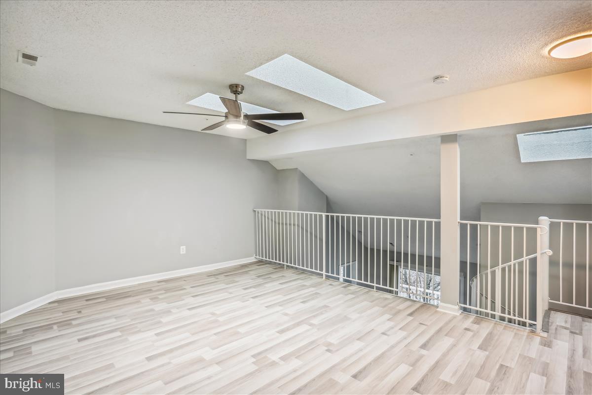 12901 Churchill Ridge Circle, Unit 14 Germantown, MD 20874 - Photo 36 of 46 a view of a room with wooden floor