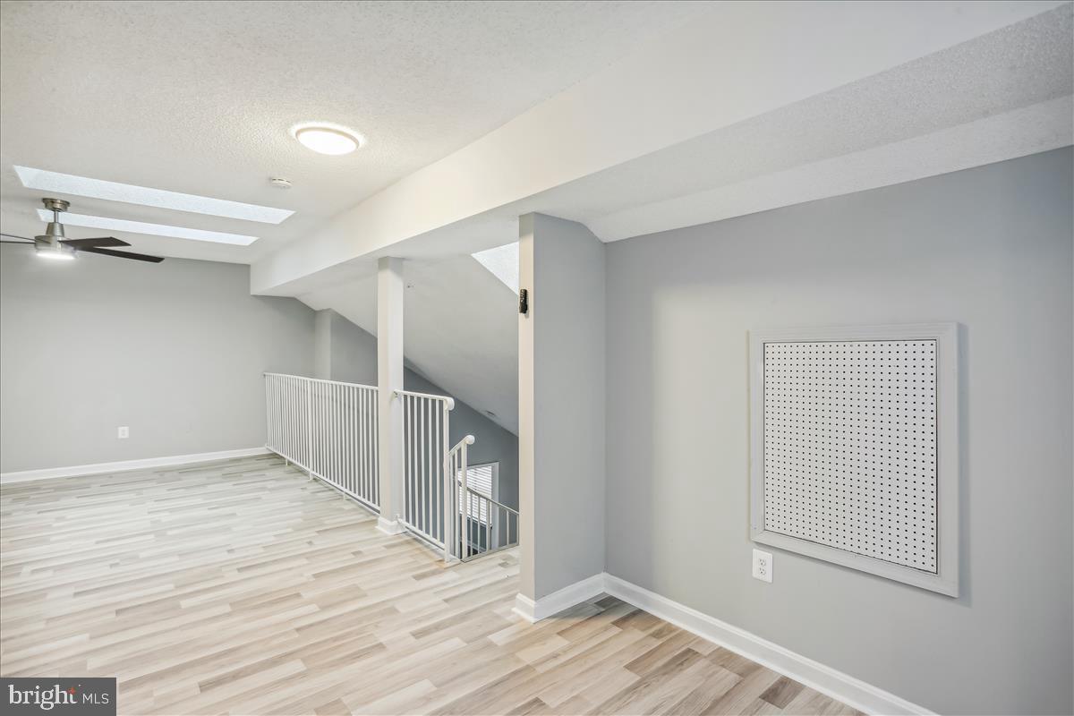 12901 Churchill Ridge Circle, Unit 14 Germantown, MD 20874 - Photo 42 of 46 wooden floor in an empty room