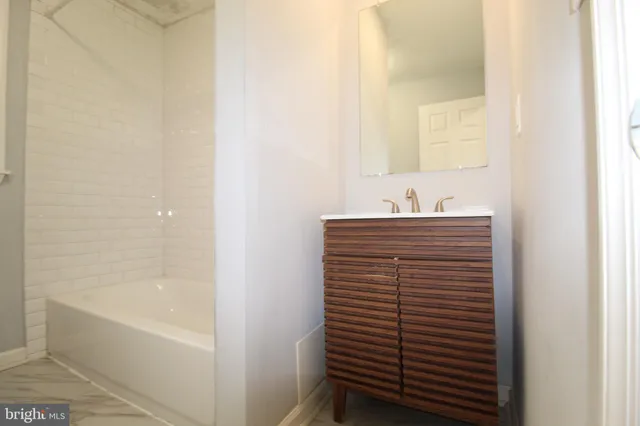 a bathroom with a sink and a bathtub