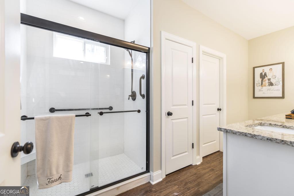 609 Live Oak Way Dublin, GA 31021 - Photo 22 of 37 a bathroom with a granite countertop shower and a sink