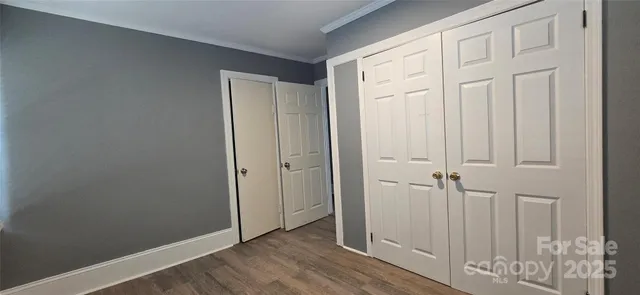 a view of an entryway with wooden floor