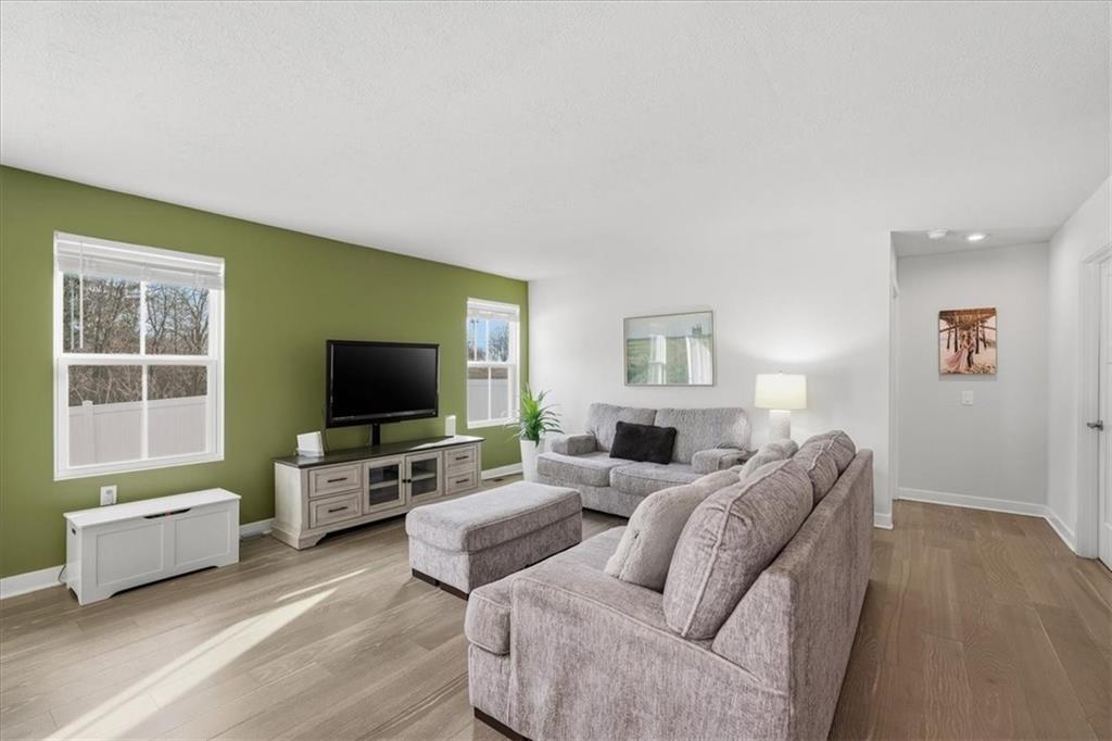 237 Smith Lane Beaver Falls, PA 15010 - Photo 12 of 25 a living room with furniture and a flat screen tv