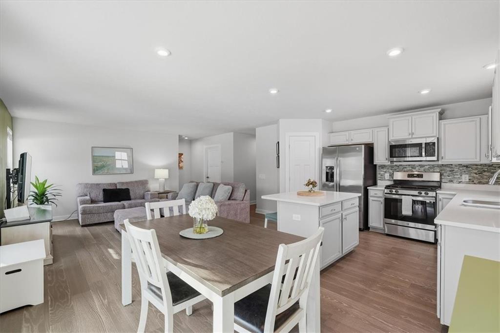 237 Smith Lane Beaver Falls, PA 15010 - Photo 13 of 25 a large kitchen with a table and chairs