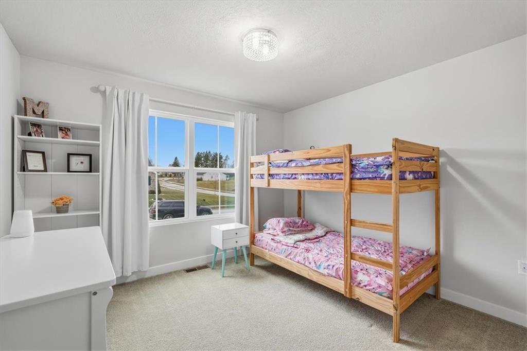 237 Smith Lane Beaver Falls, PA 15010 - Photo 21 of 25 a bedroom with a bed and a window
