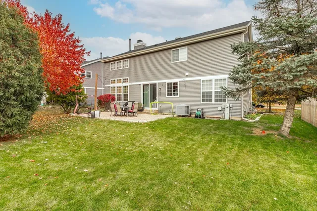 a view of a house with a back yard