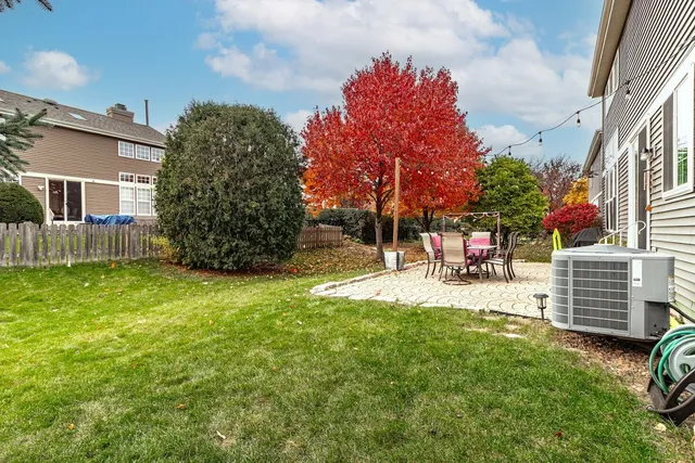 a view of backyard with a garden and entertaining space