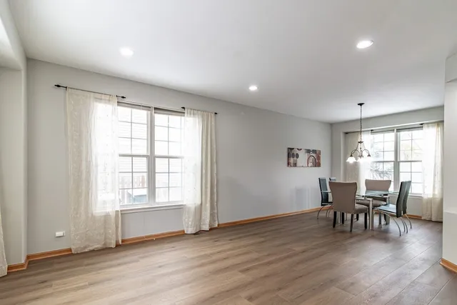 a view of a work space with furniture and wooden floor