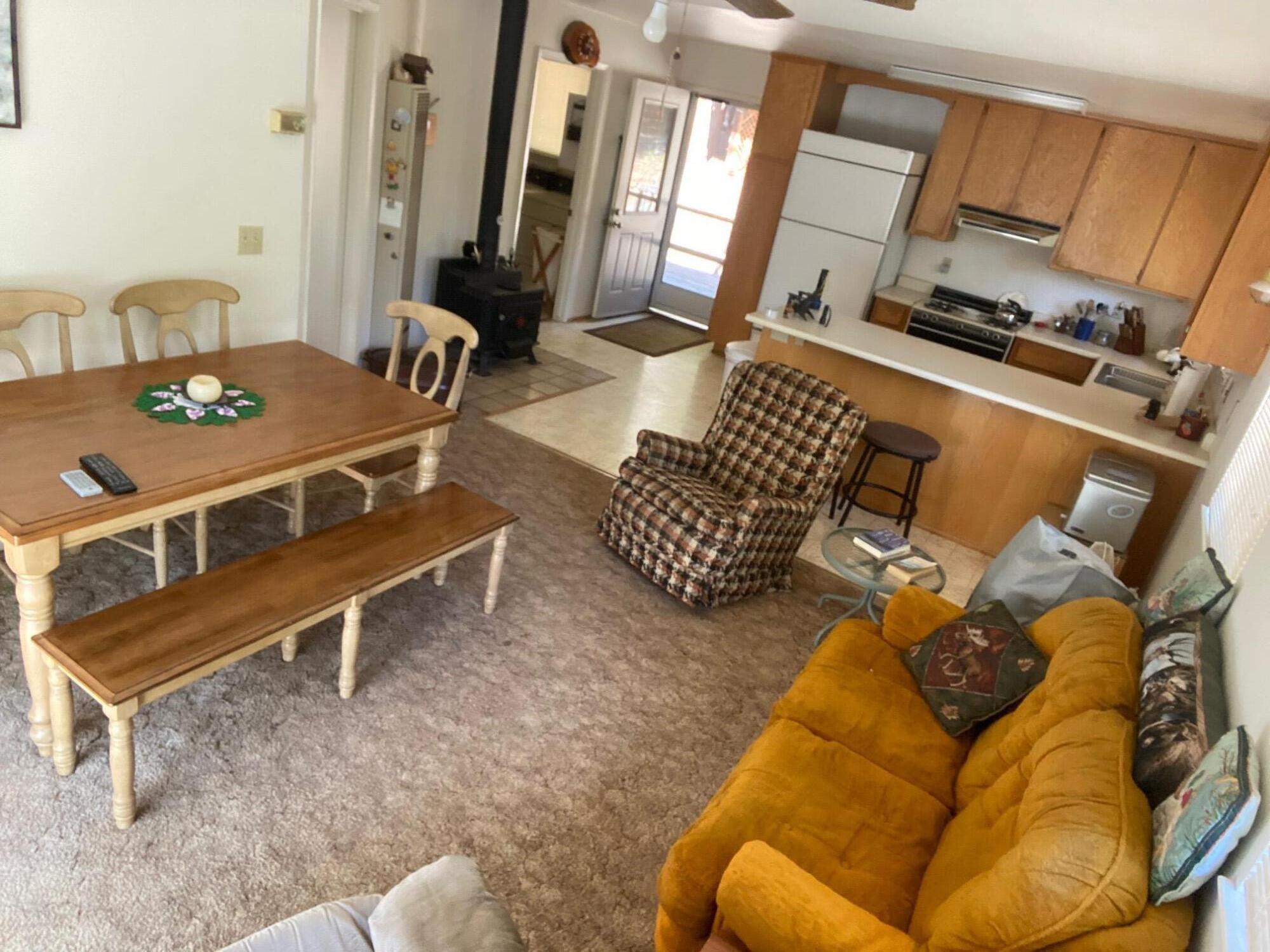 581 Mountain Aire Road Trinity Center, CA 96091 - Photo 7 of 48 Living, dining, kitchen and wood stove