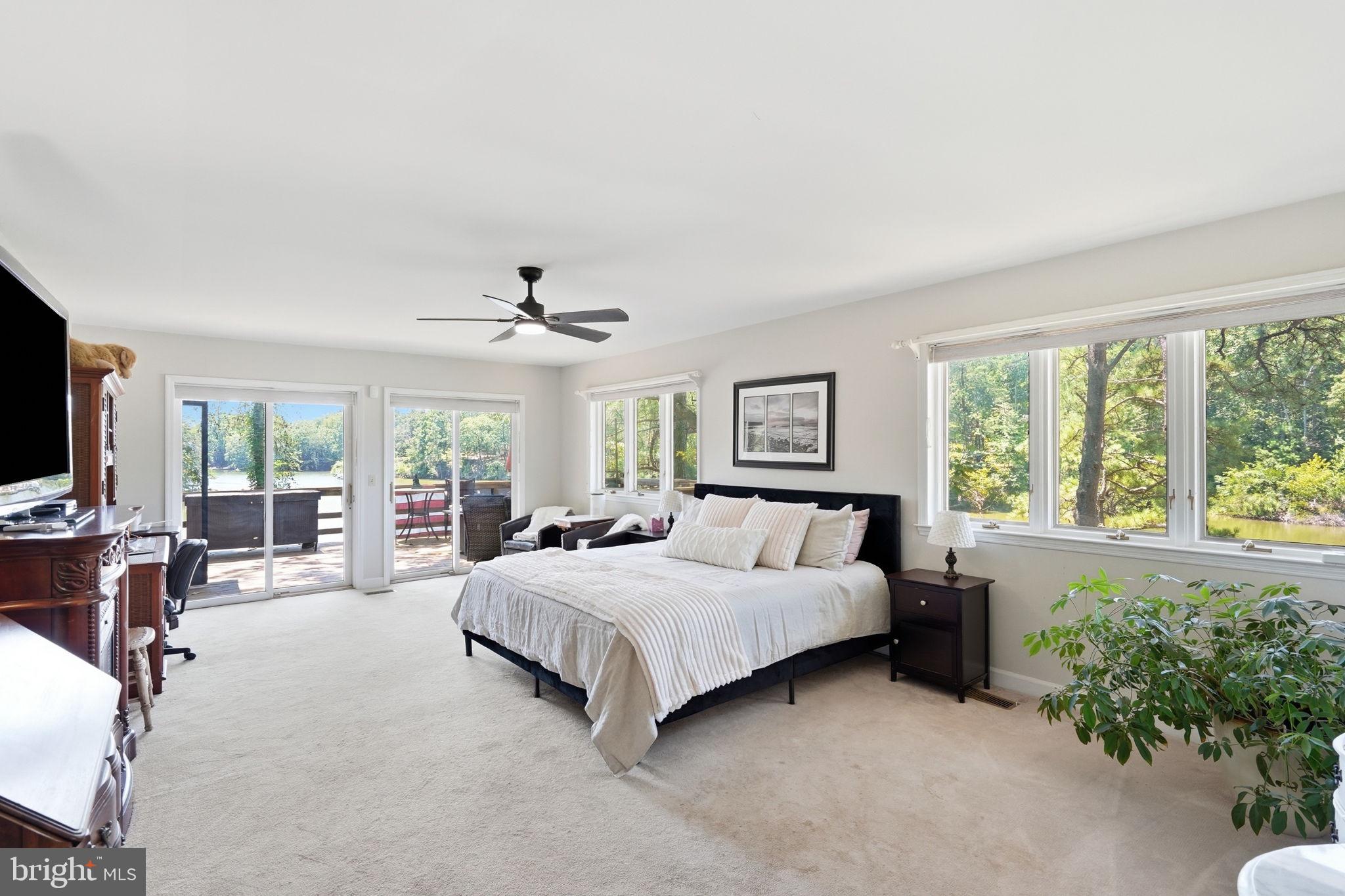 750 Levelgreen Road Lancaster, VA 22503 - Photo 39 of 107 Primary suite w/ 2 sliding doors to deck!