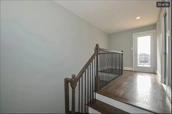 a view of entryway with wooden floor