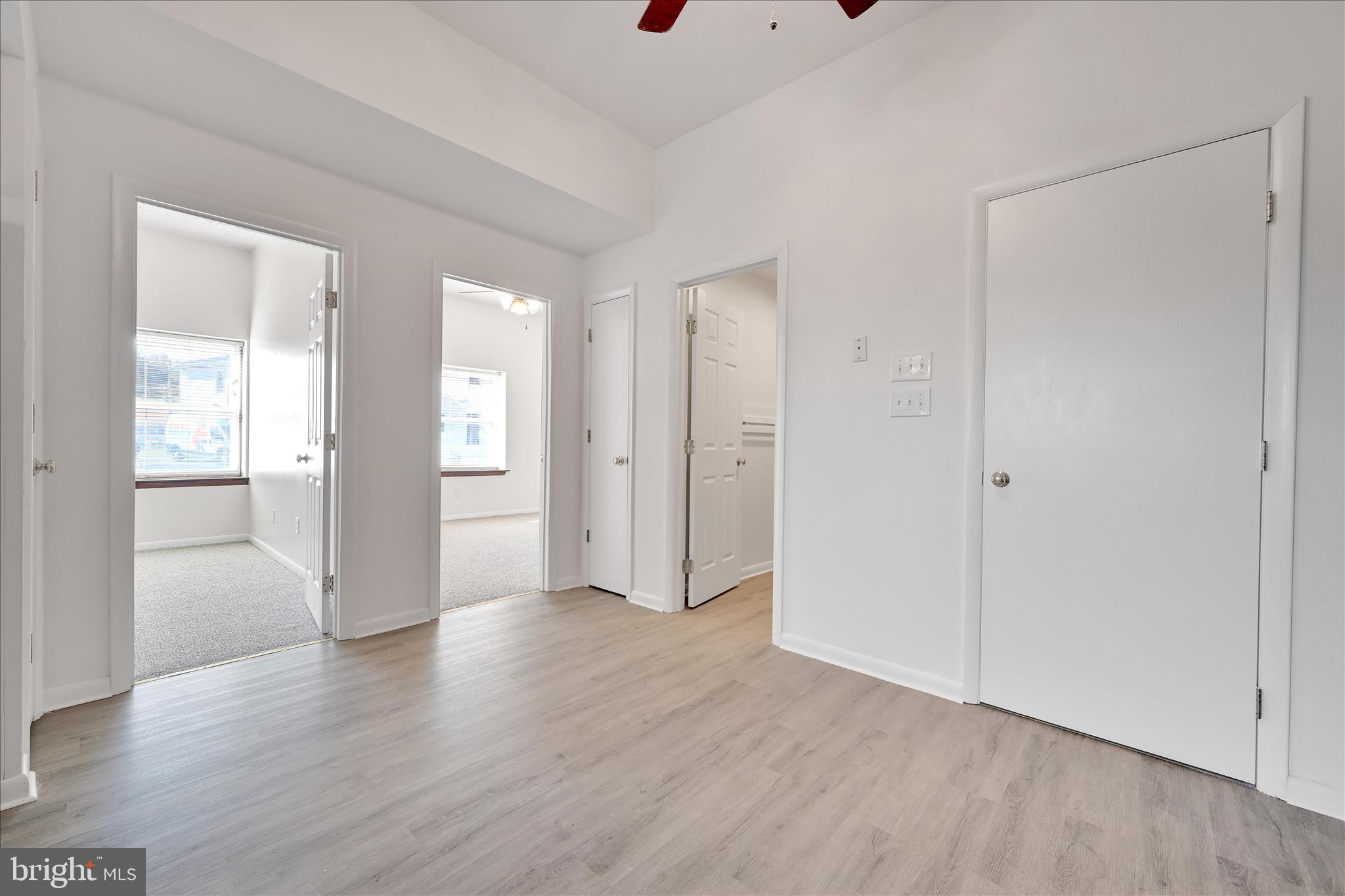 709 Hill Road, Unit 7 Wernersville, PA 19565 - Photo 13 of 24 a view of an empty room with wooden floor and a window