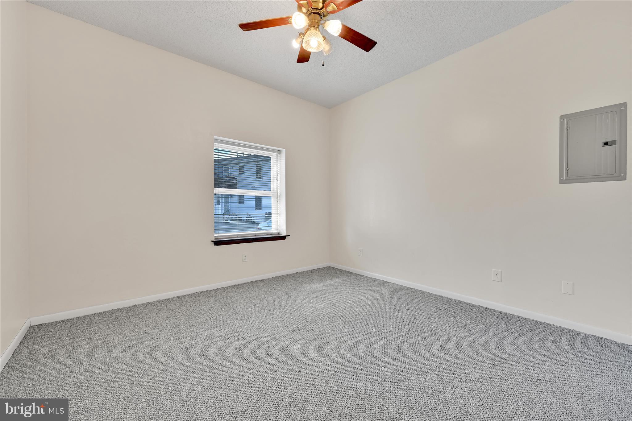 709 Hill Road, Unit 7 Wernersville, PA 19565 - Photo 15 of 24 an empty room with chandelier fan