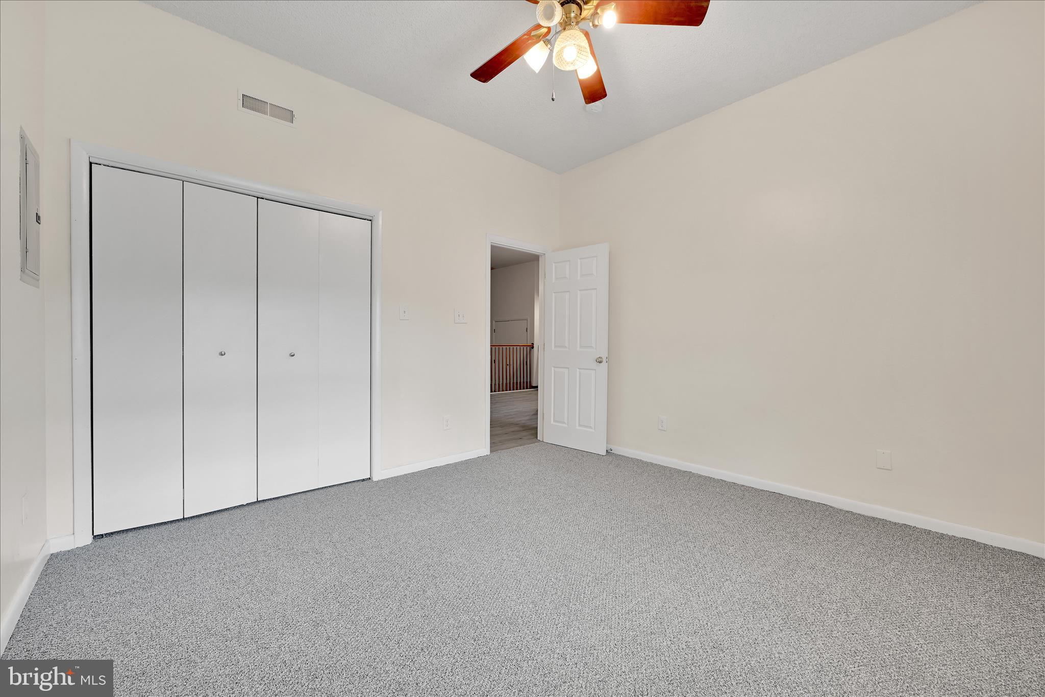 709 Hill Road, Unit 7 Wernersville, PA 19565 - Photo 19 of 24 an empty room with a empty space and chandelier fan