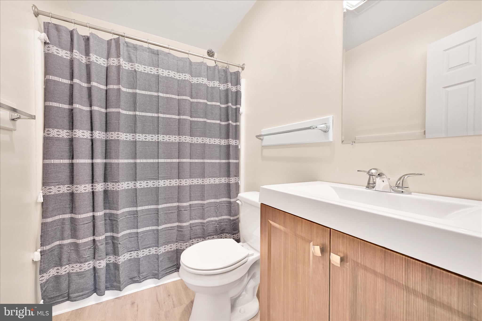 709 Hill Road, Unit 7 Wernersville, PA 19565 - Photo 20 of 24 a bathroom with a sink a toilet and a mirror