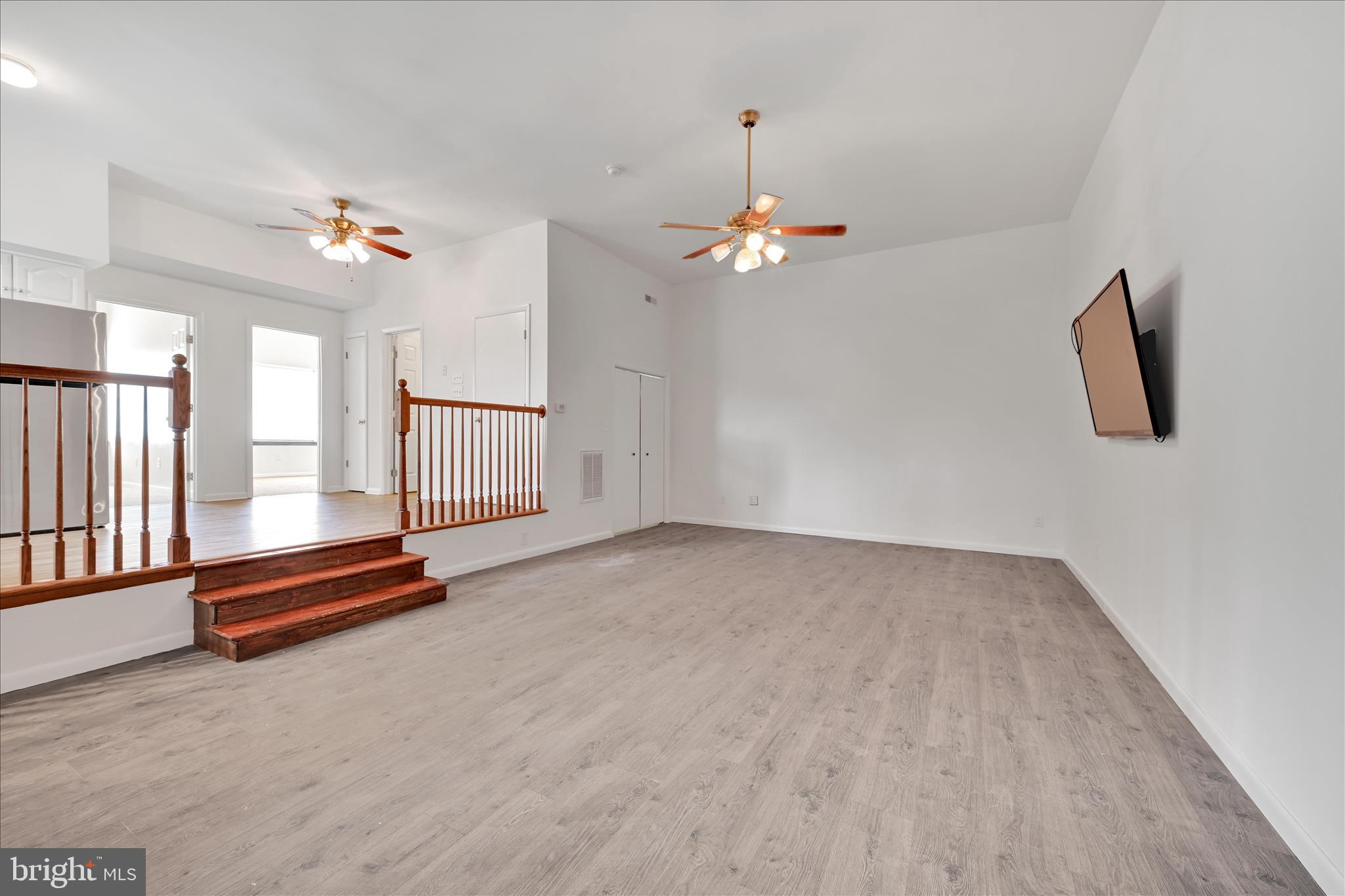 709 Hill Road, Unit 7 Wernersville, PA 19565 - Photo 2 of 24 wooden floor in an empty room with a window