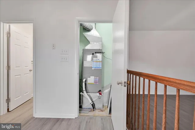 a view of a hallway with a dining room