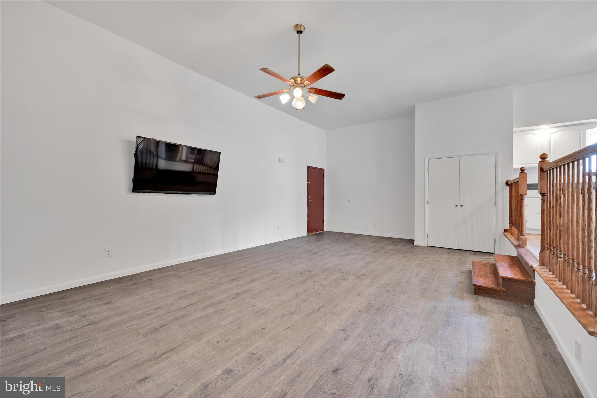 709 Hill Road, Unit 7 Wernersville, PA 19565 - Photo 6 of 24 a view of a livingroom with a ceiling fan wooden floor and a ceiling fan