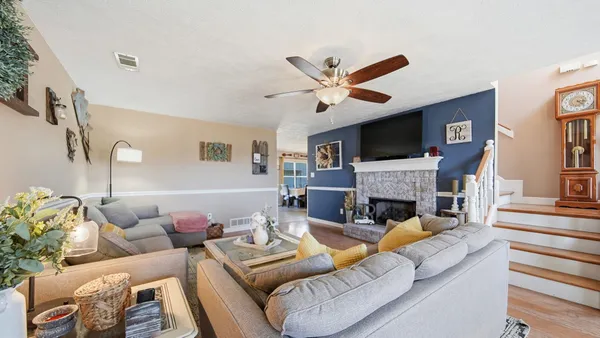 a living room with furniture a bed and a couch
