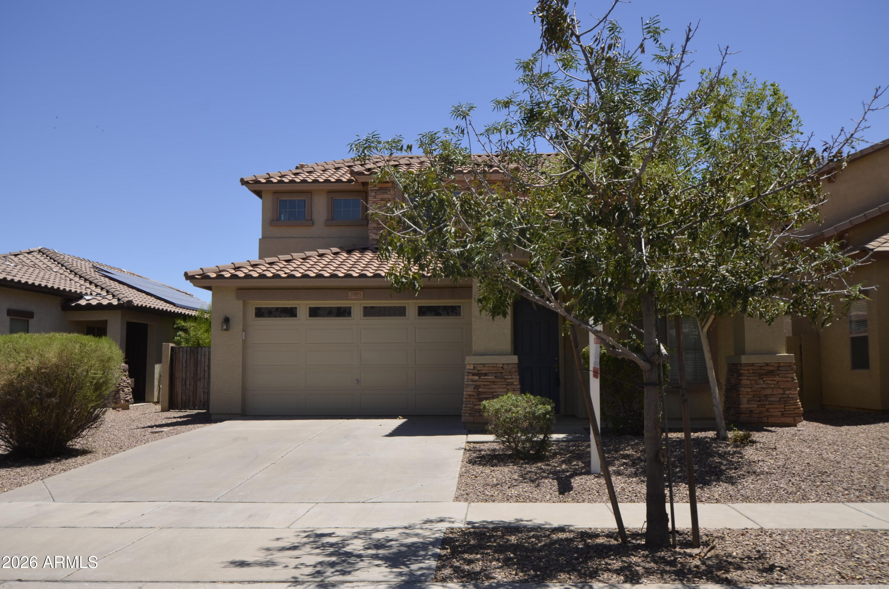 3995 East Trigger Way Gilbert, AZ 85297 - Photo 1 of 23 a view of a house with a yard