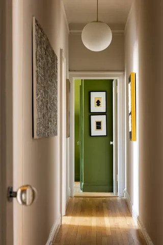 a view of a kitchen with a sink and cabinets