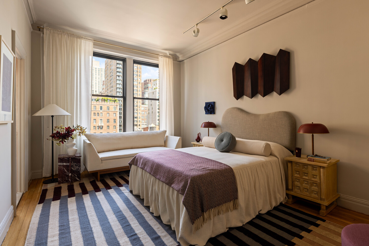 993 Park Avenue, Unit 11A Manhattan, NY 10028 - Photo 18 of 24 a bedroom with a bed and wooden floor