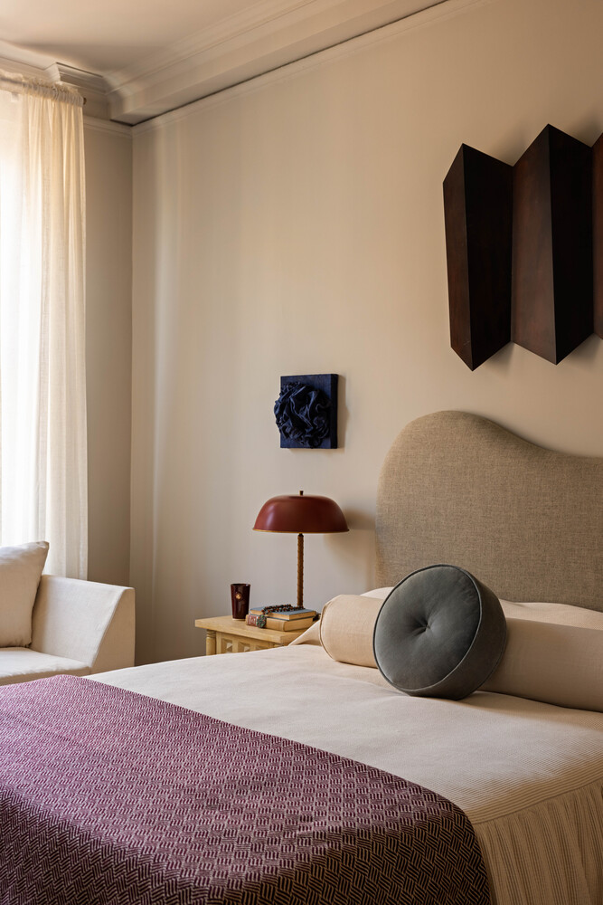 993 Park Avenue, Unit 11A Manhattan, NY 10028 - Photo 19 of 24 a bedroom with a bed and teddy bear on bed