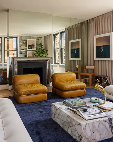 a living room with fireplace furniture and a flat screen tv