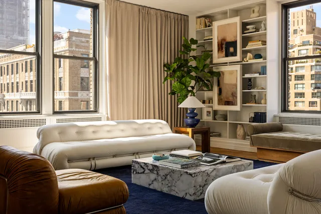 a bedroom with furniture and a fireplace