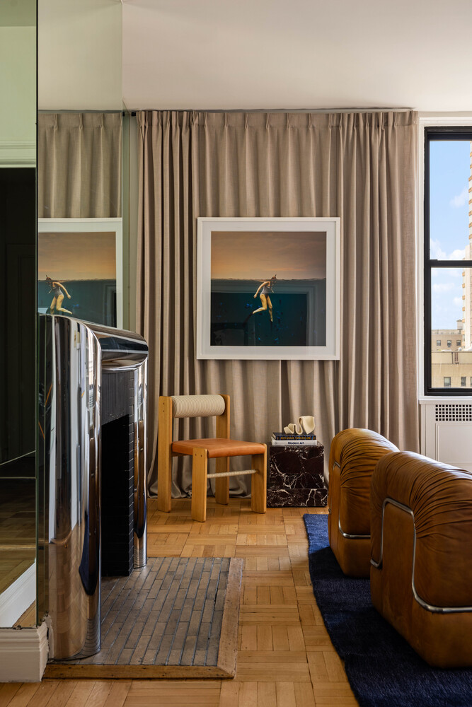 993 Park Avenue, Unit 11A Manhattan, NY 10028 - Photo 6 of 24 a living room with furniture and a flat screen tv