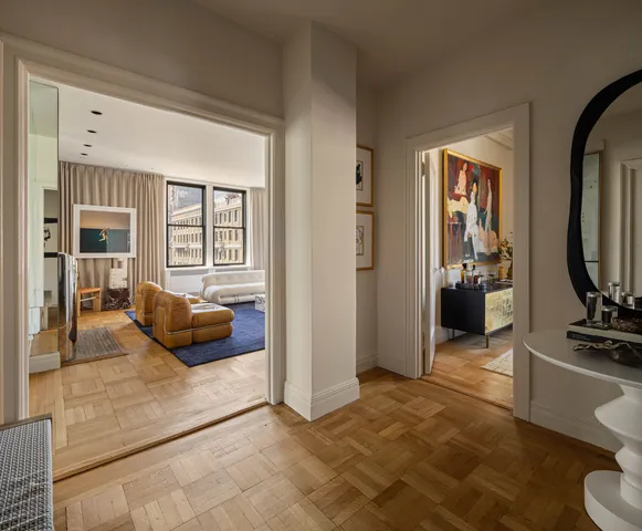 a view of living room with furniture and wooden floor