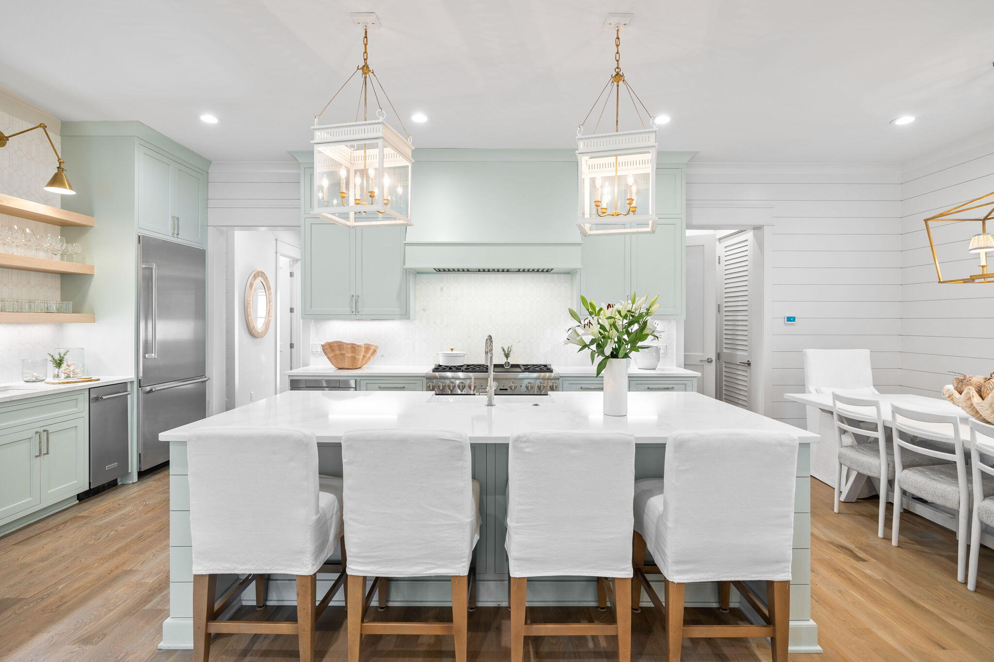 37 Creek Bridge Way Inlet Beach, FL 32461 - Photo 16 of 29 a kitchen with stainless steel appliances kitchen island granite countertop a dining table chairs and a refrigerator