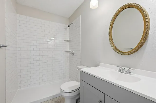 a view of a backyard with wooden fence